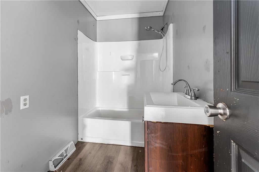819 Bute Road Uniontown, PA 15401 - Photo 11 of 19 a bathroom with a sink and a mirror