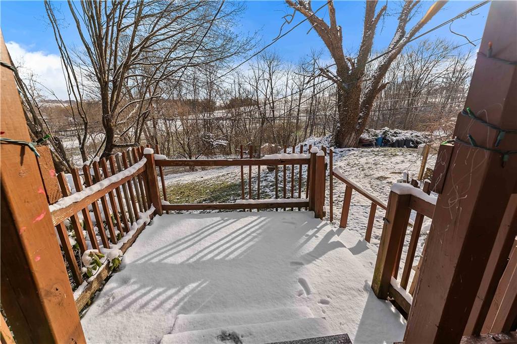 819 Bute Road Uniontown, PA 15401 - Photo 13 of 19 a view of backyard with deck and outdoor seating