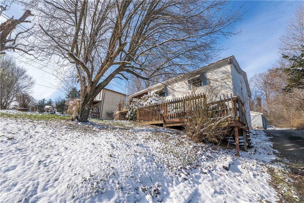 819 Bute Road Uniontown, PA 15401 - Photo 3 of 19 a backyard of a house with large trees