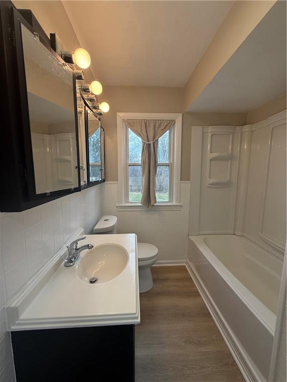 4450 Morefield Road Hermitage, PA 16148 - Photo 16 of 16 a bathroom with a sink a toilet a mirror and bathtub