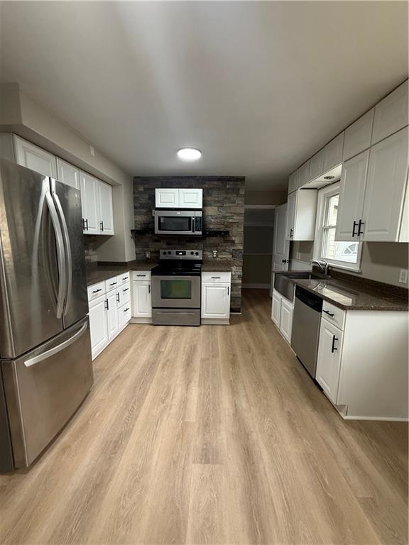 4450 Morefield Road Hermitage, PA 16148 - Photo 8 of 16 a kitchen with stainless steel appliances granite countertop a refrigerator a stove top oven a sink and dishwasher