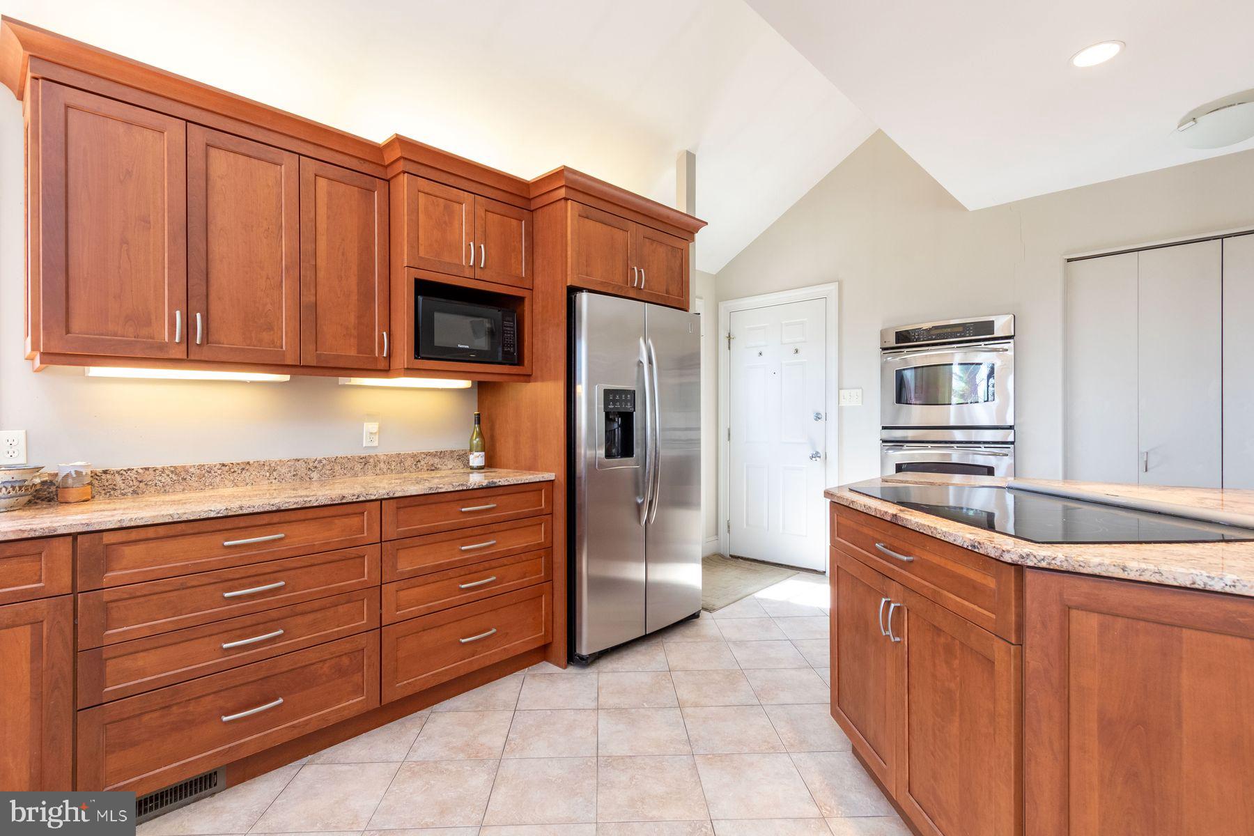 20 Solebury Mountain Road New Hope, PA 18938 - Photo 21 of 43 a kitchen with stainless steel appliances granite countertop a sink stove and refrigerator