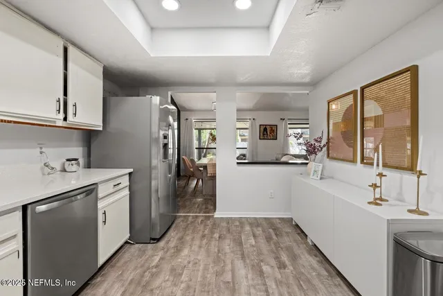 a kitchen with a sink stove and refrigerator