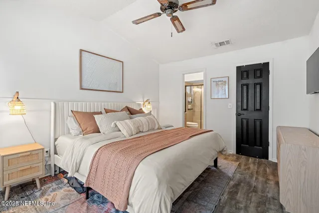 a bedroom with bed and a window