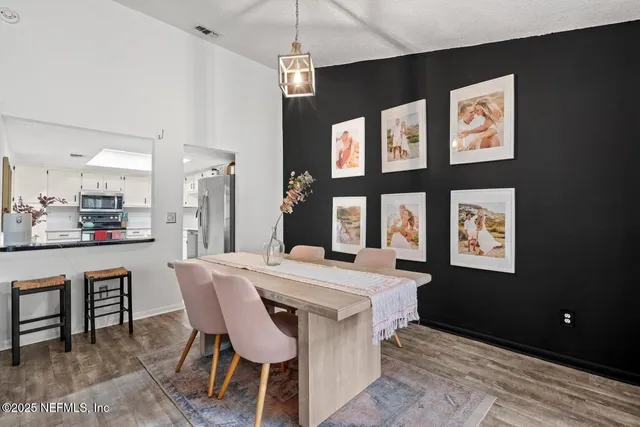 a view of a dining room with furniture
