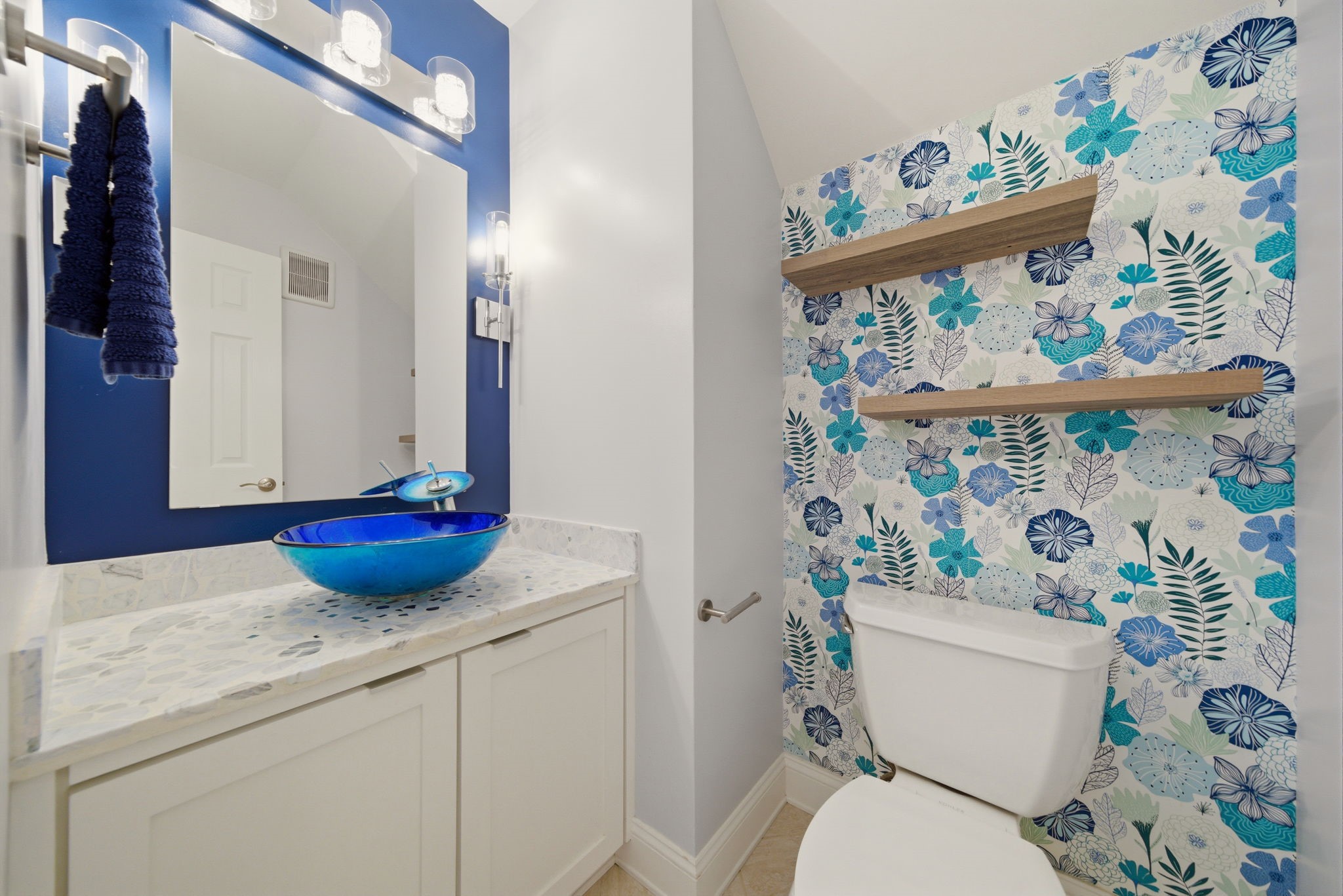 6452 Burgoyne Road, Unit 100 Houston, TX 77057 - Photo 19 of 44 a bathroom with a granite countertop toilet and a sink