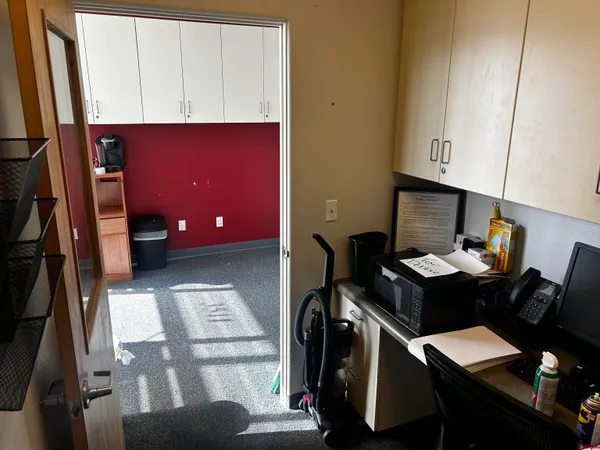 a workspace with furniture and window