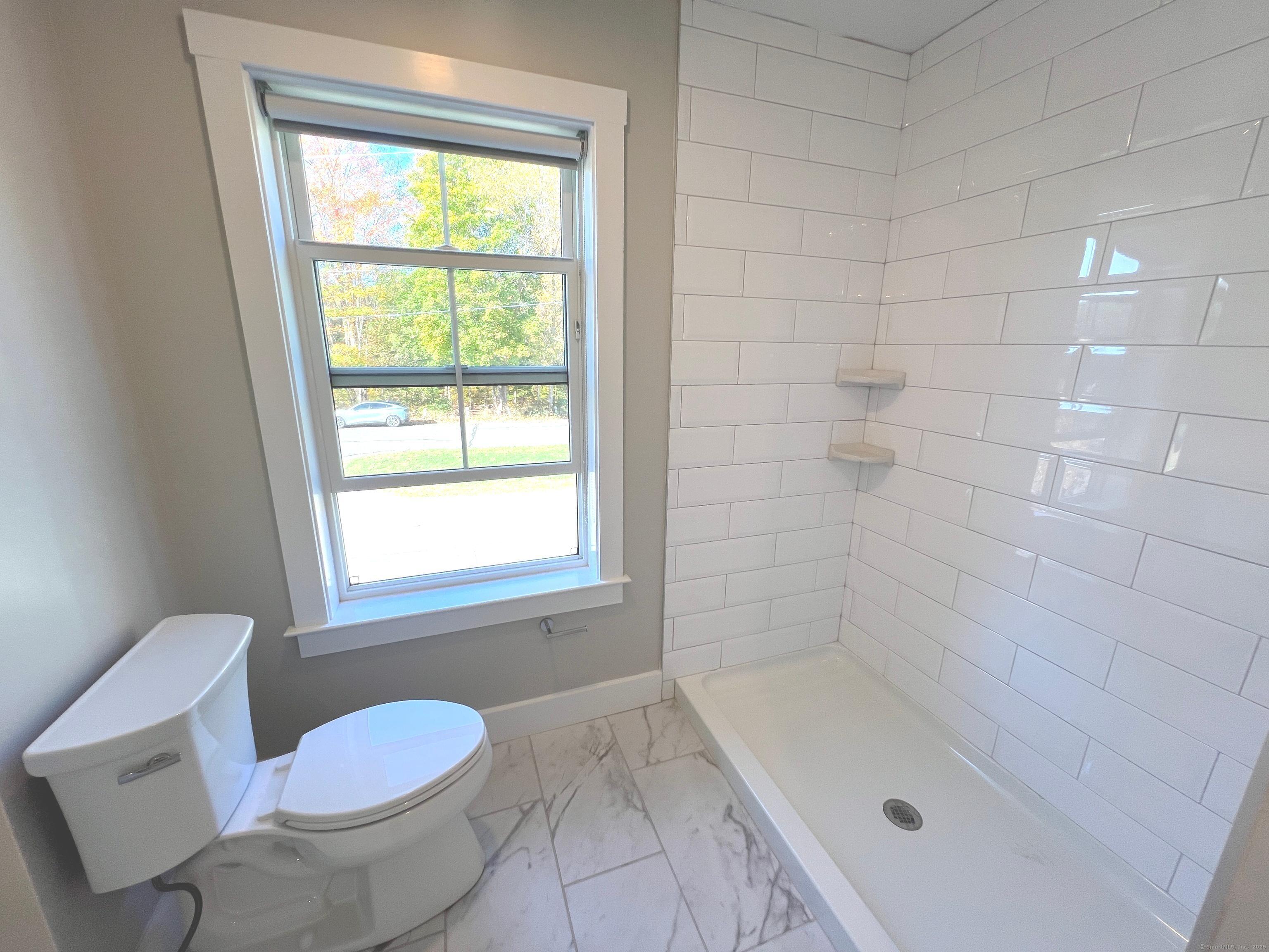 37 Old Rte 7, Unit 4 Brookfield, CT 06804 - Photo 15 of 22 a bathroom with a bathtub and window