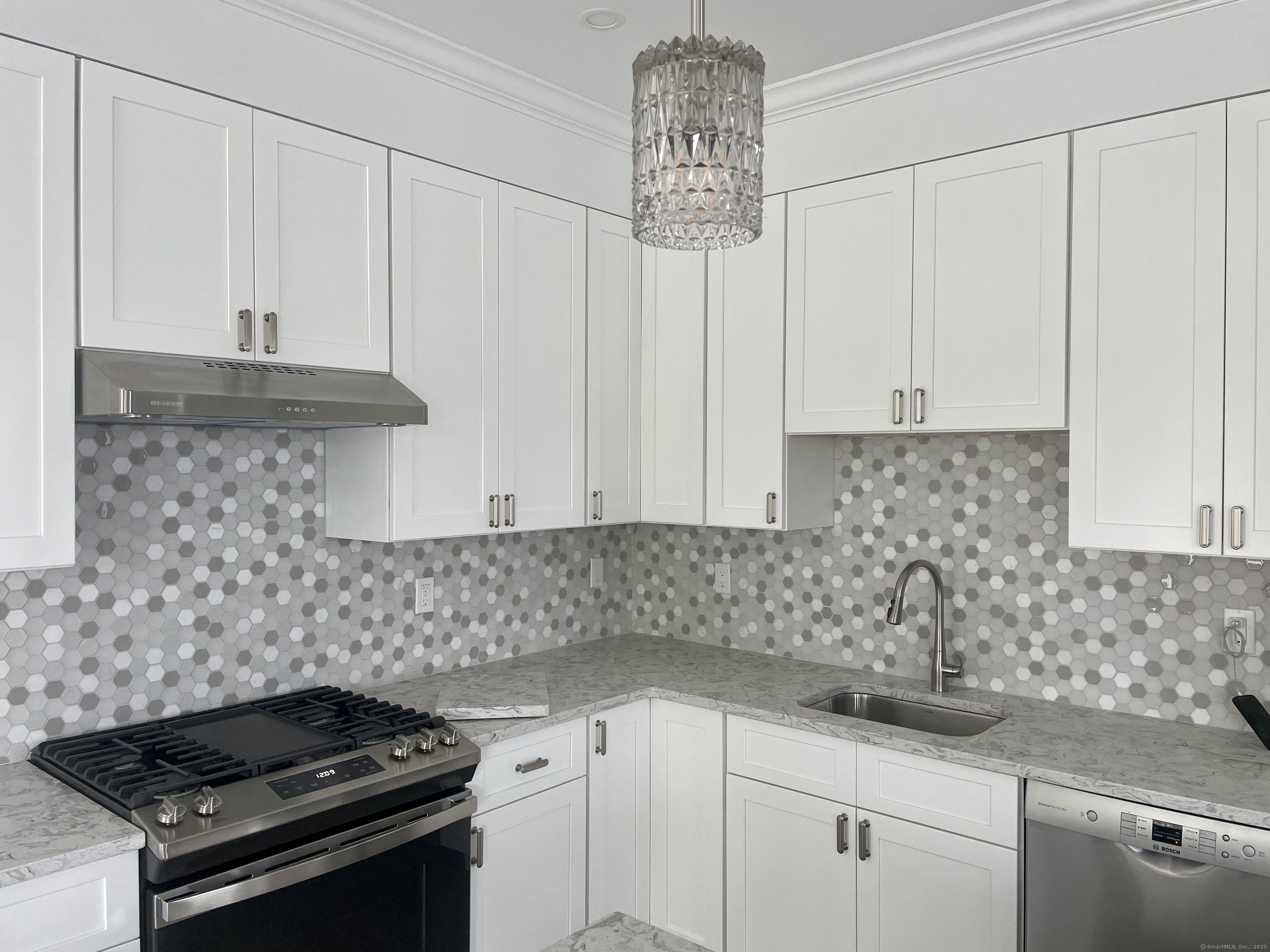 37 Old Rte 7, Unit 4 Brookfield, CT 06804 - Photo 4 of 22 a kitchen with white cabinets and appliances