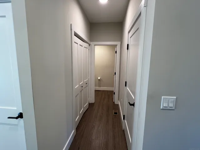 a view of a bathroom from a hallway