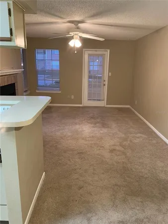 a view of an empty room with windows