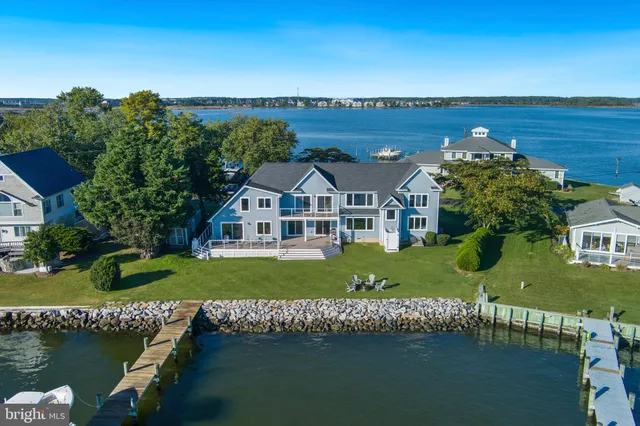an aerial view of a house with garden space and street view