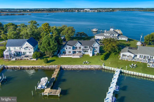 aerial view of a house with a lake view