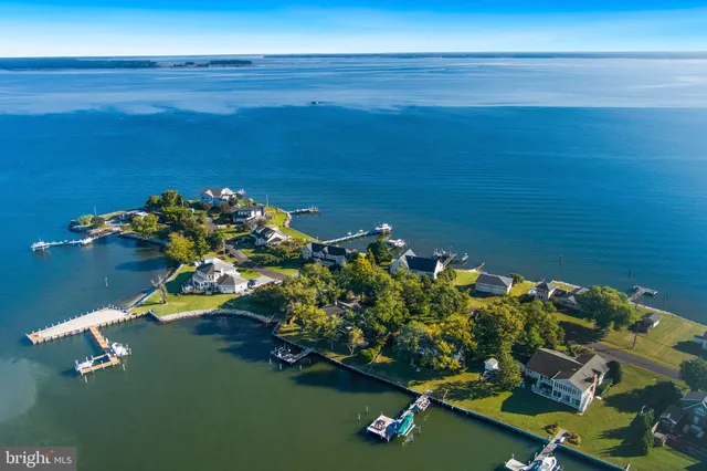 an aerial view of a house with a yard swimming pool outdoor seating and yard