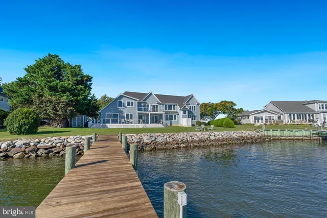 an aerial view of a house with a yard basket ball court and outdoor seating