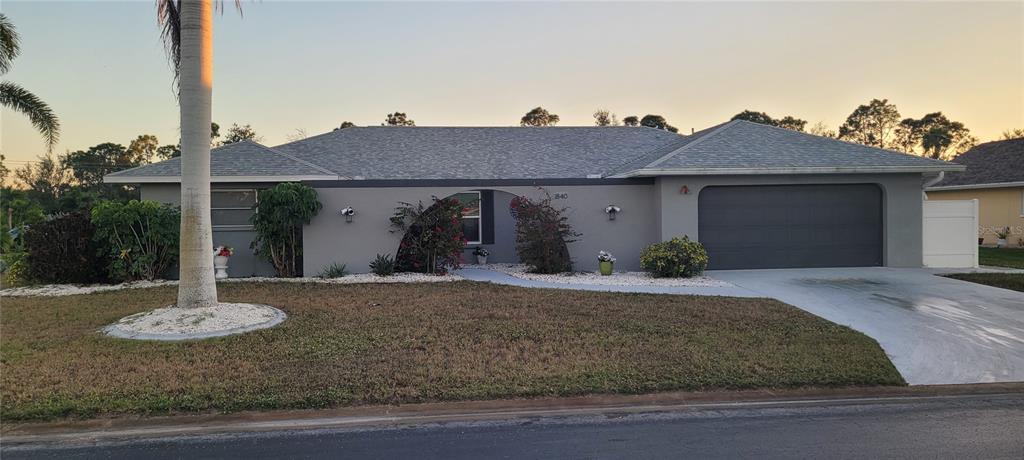 1840 Flametree Lane Venice, FL 34293 - Photo 1 of 26 a front view of a house with a yard