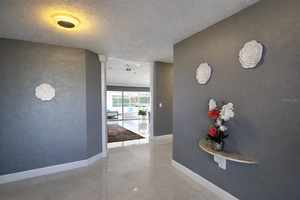 1840 Flametree Lane Venice, FL 34293 - Photo 14 of 26 wooden floor in an empty room with a window