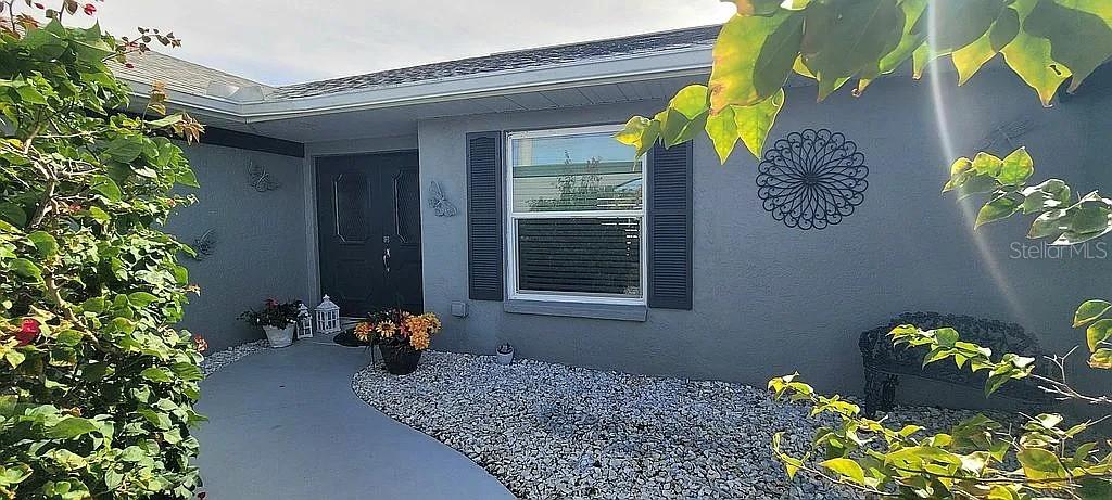 1840 Flametree Lane Venice, FL 34293 - Photo 2 of 26 a front view of a house