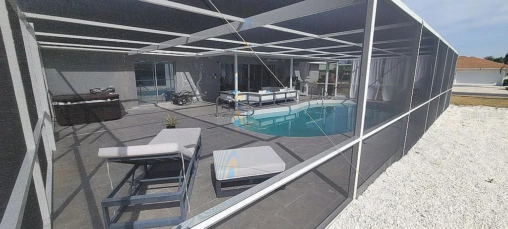 1840 Flametree Lane Venice, FL 34293 - Photo 23 of 26 a view of swimming pool with seating area