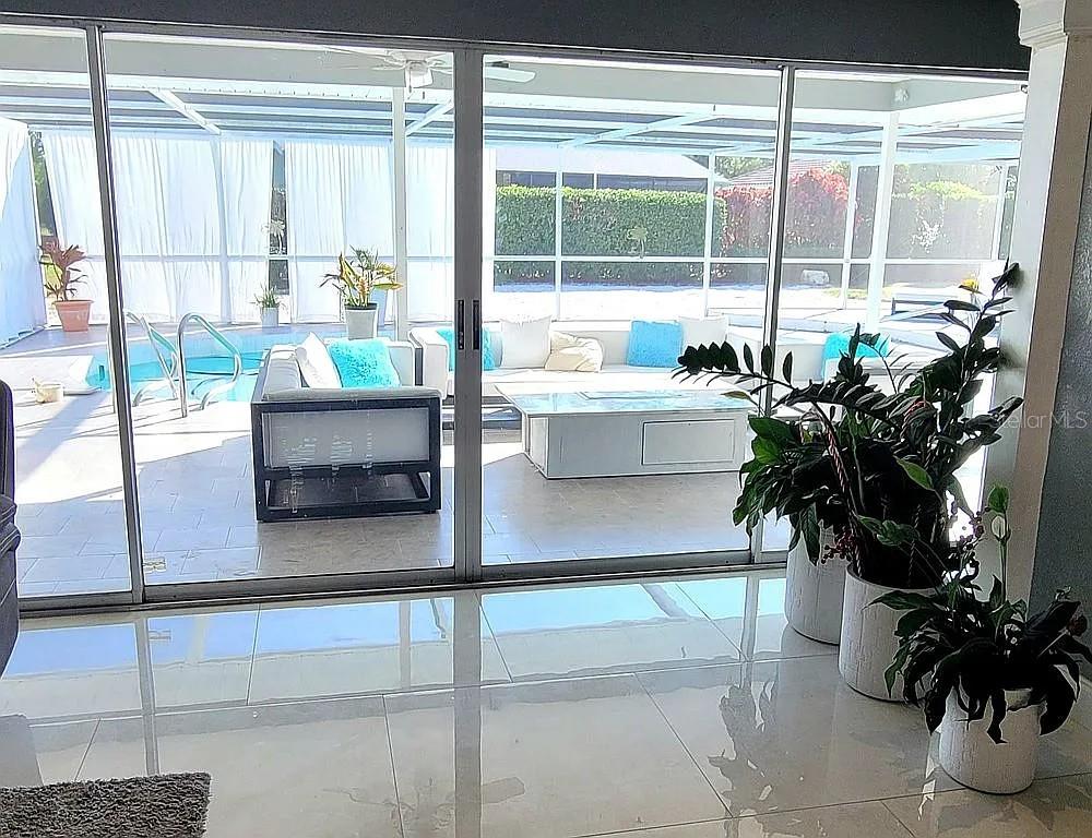 1840 Flametree Lane Venice, FL 34293 - Photo 25 of 26 a living room with furniture and a potted plant
