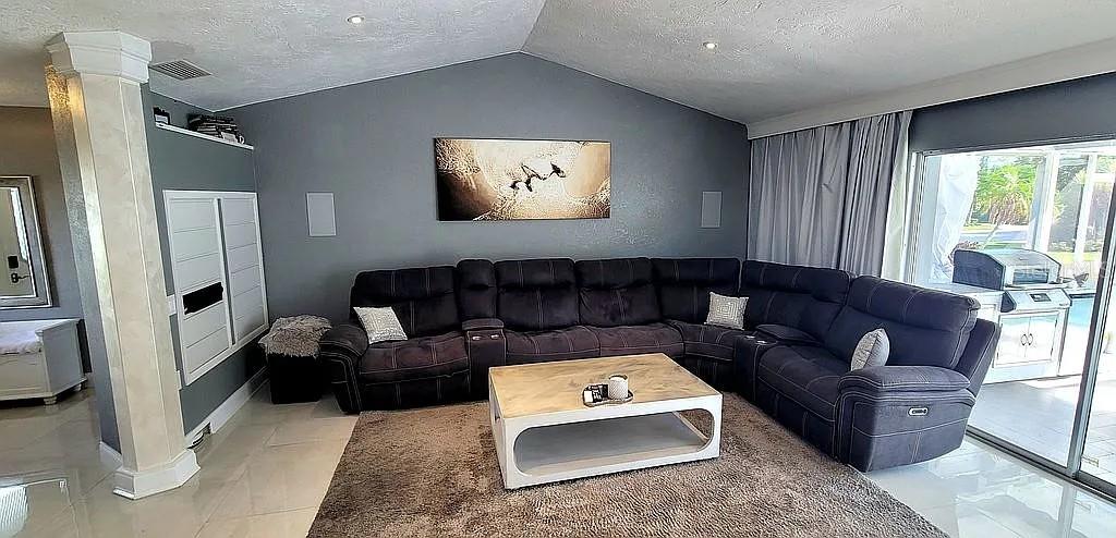1840 Flametree Lane Venice, FL 34293 - Photo 4 of 26 a living room with furniture and a rug