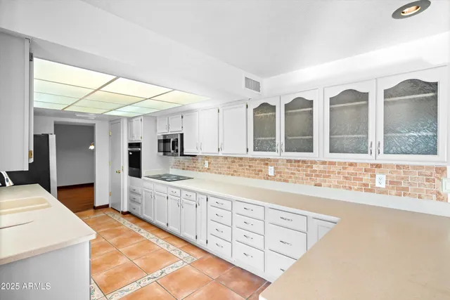 a large bathroom with a large tub and sink