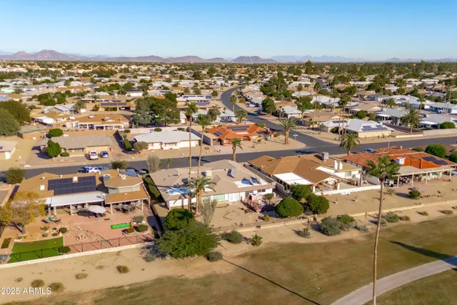 an aerial view of residential building and parking space