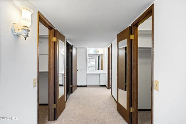 a view of a hallway with closet area