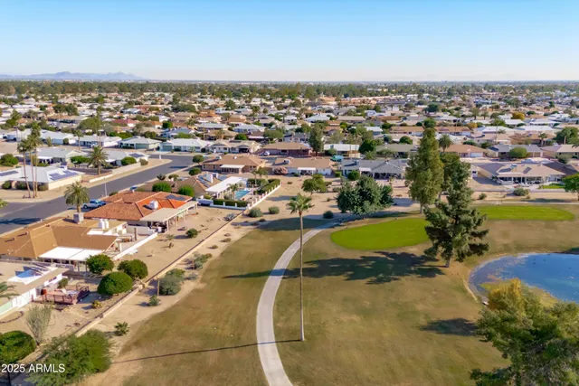 an aerial view of residential houses with outdoor space