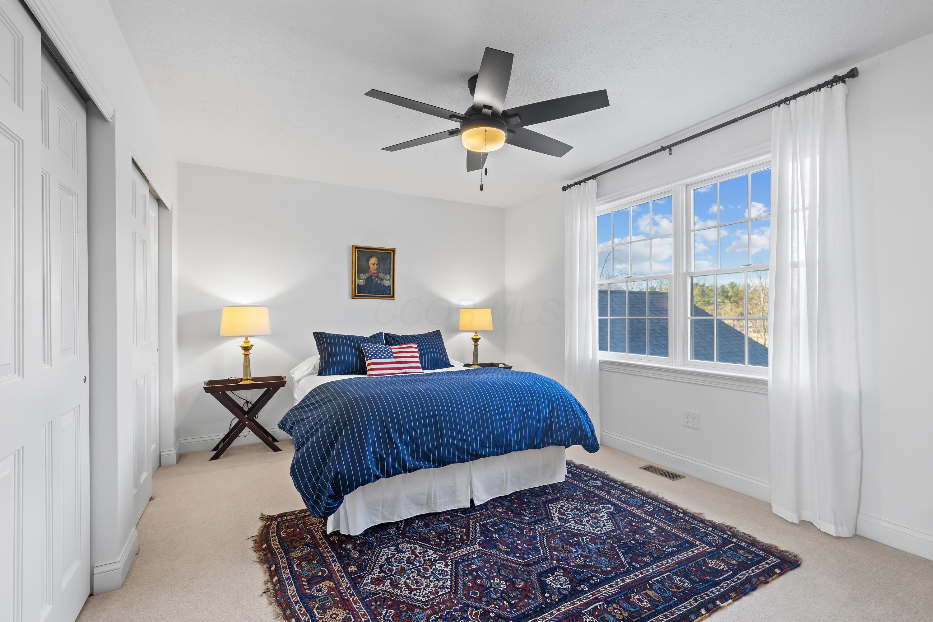 1364 Dale Ford Road Delaware, OH 43015 - Photo 58 of 112 • Light sand carpet • White painted walls • Attic access • Lighted ceiling fan • Closet with double sliding doors • Jack & Jill bath access • Drapes remain