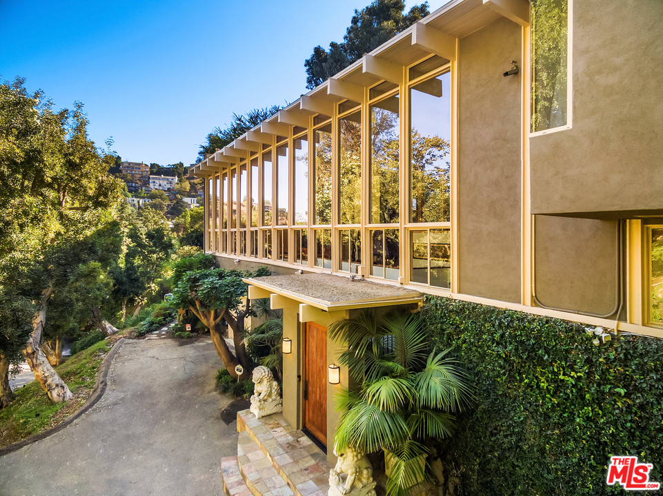 7330 Pyramid Drive Los Angeles, CA 90068 - Photo 2 of 37 a balcony with table and chairs