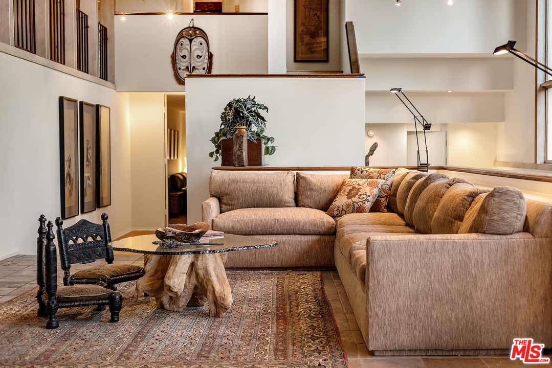7330 Pyramid Drive Los Angeles, CA 90068 - Photo 11 of 37 a living room with furniture and a clock