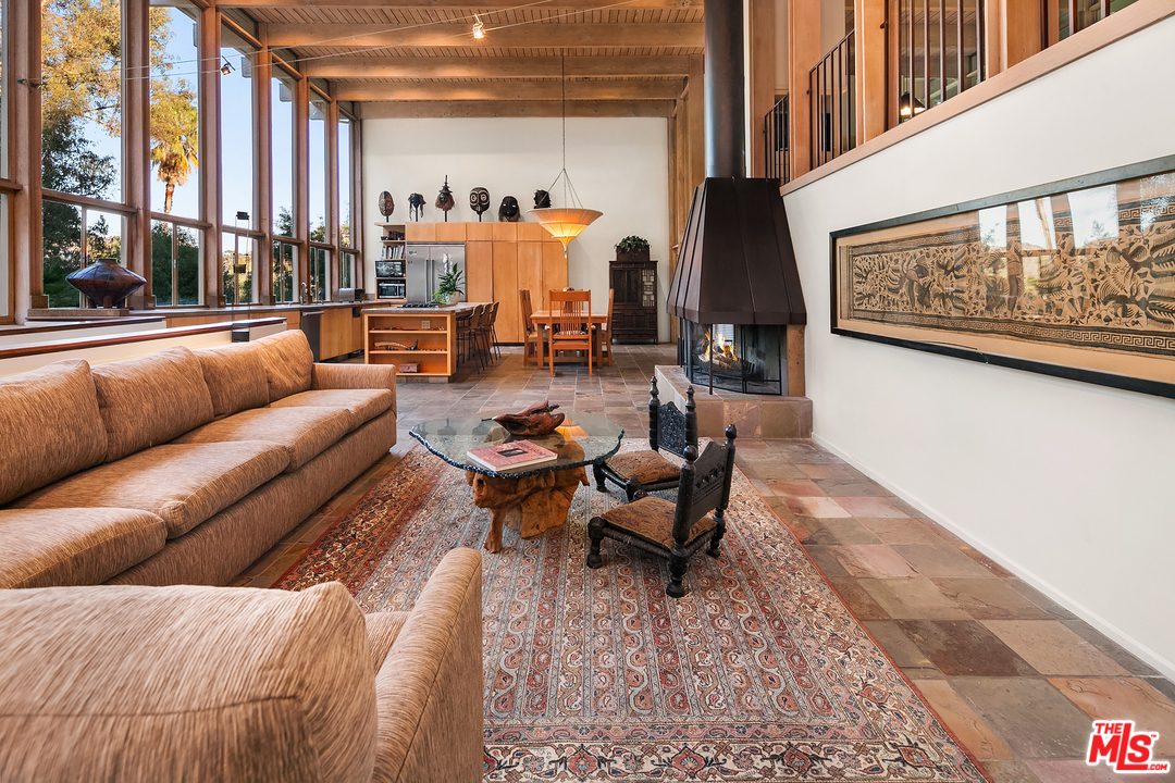7330 Pyramid Drive Los Angeles, CA 90068 - Photo 12 of 37 a living room with furniture and a painting on the wall