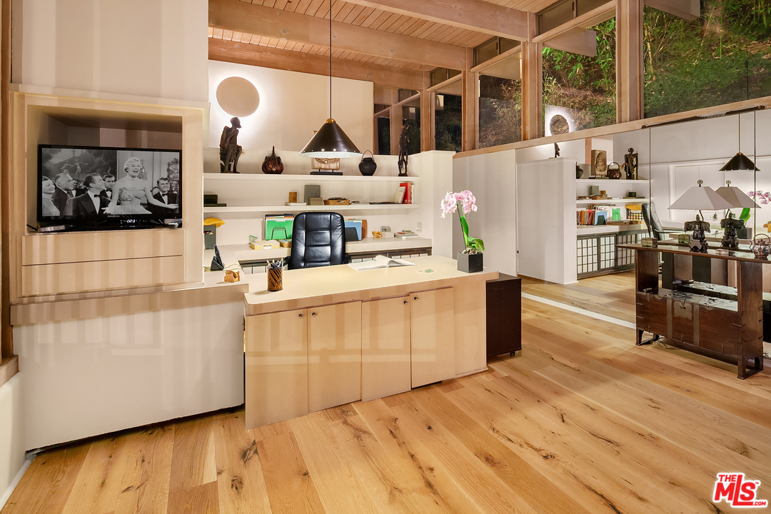 7330 Pyramid Drive Los Angeles, CA 90068 - Photo 18 of 37 a kitchen with stainless steel appliances a stove a window and wooden floor