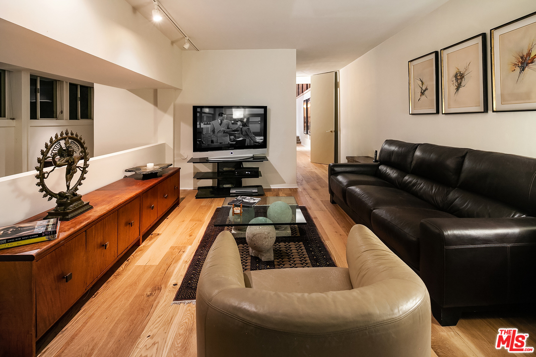 7330 Pyramid Drive Los Angeles, CA 90068 - Photo 20 of 37 a living room with furniture and a flat screen tv