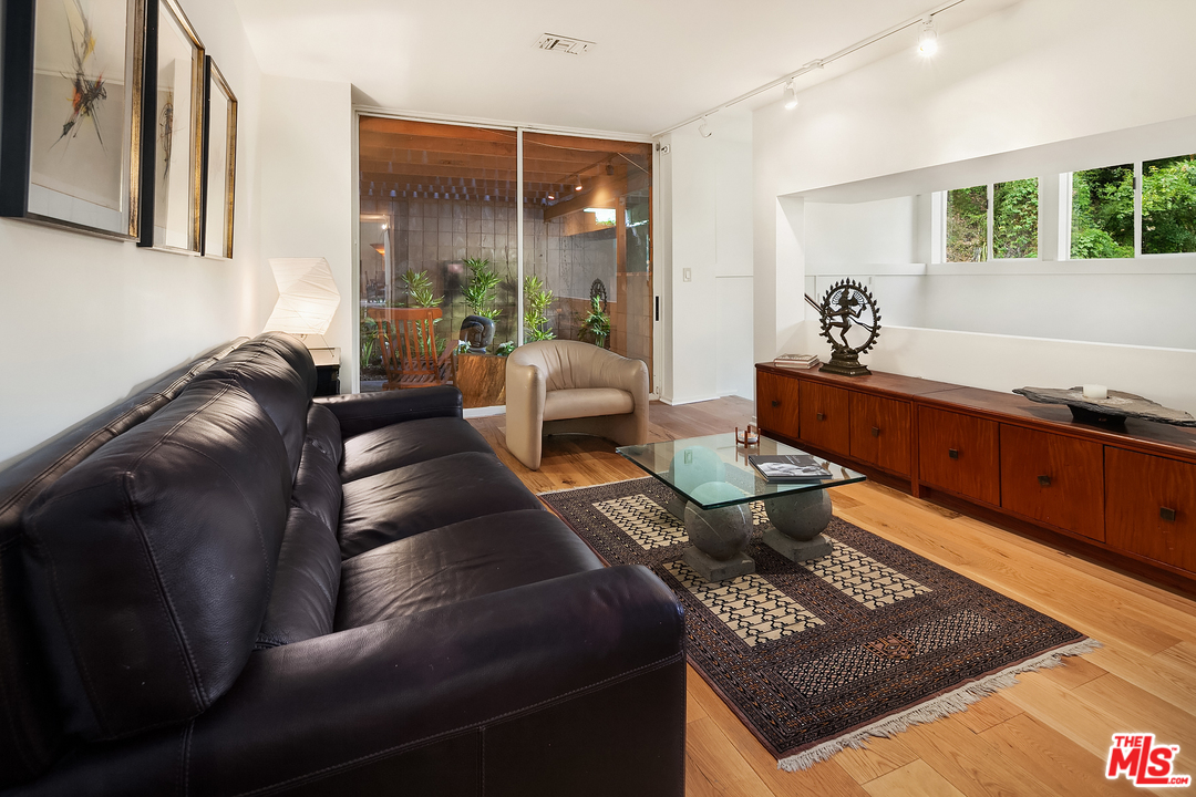 7330 Pyramid Drive Los Angeles, CA 90068 - Photo 21 of 37 a living room with furniture and a large window