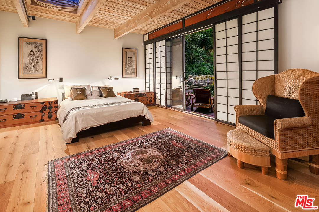 7330 Pyramid Drive Los Angeles, CA 90068 - Photo 26 of 37 a bedroom with furniture and a fireplace