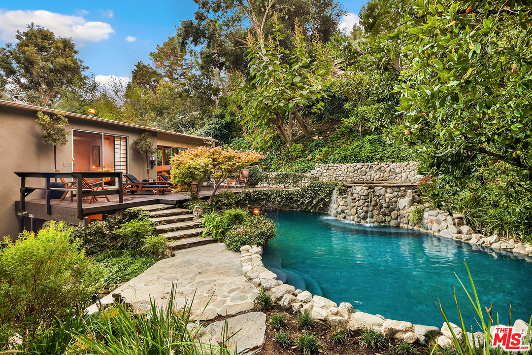 7330 Pyramid Drive Los Angeles, CA 90068 - Photo 32 of 37 a backyard of a house with lots of green space and lake view