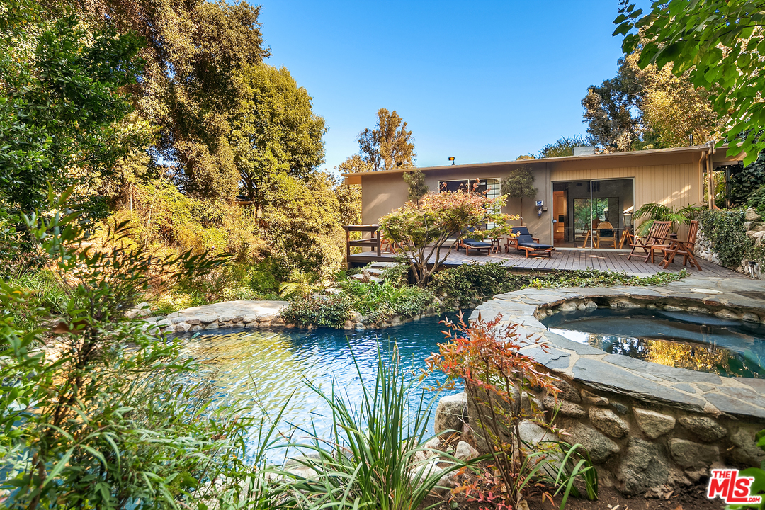 7330 Pyramid Drive Los Angeles, CA 90068 - Photo 33 of 37 a house with swimming pool in front