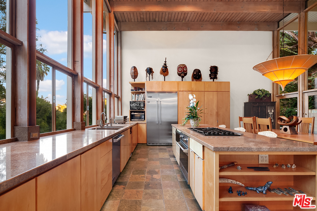 7330 Pyramid Drive Los Angeles, CA 90068 - Photo 6 of 37 a kitchen with stainless steel appliances granite countertop a stove a sink and a refrigerator
