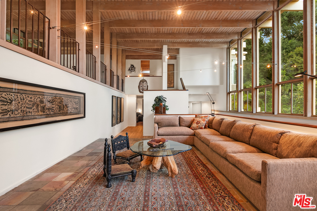 7330 Pyramid Drive Los Angeles, CA 90068 - Photo 10 of 37 a living room with furniture and a table