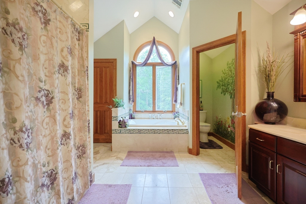 70 Azalea Way Hanson, MA 02341 - Photo 28 of 42 a hallway with a view of living room