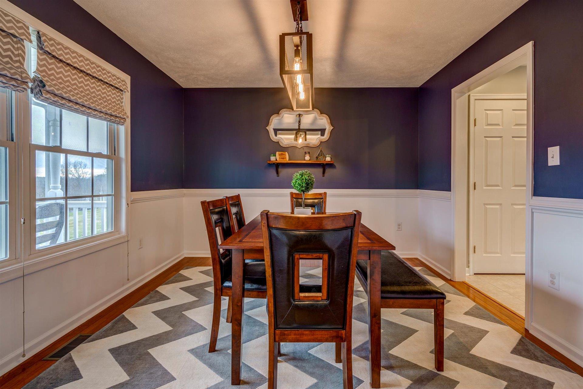 1183 Carroll Road Goodview, VA 24095 - Photo 19 of 61 a dining room with furniture a chandelier and window