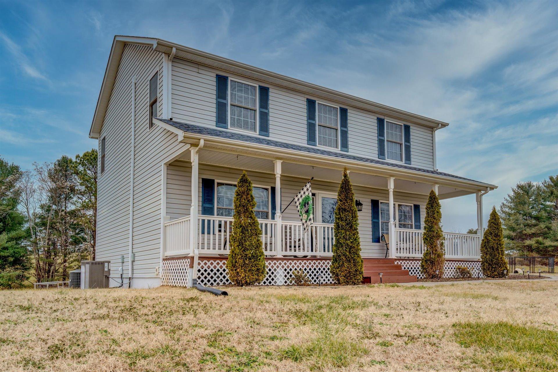 1183 Carroll Road Goodview, VA 24095 - Photo 3 of 61 a front view of a house with a yard