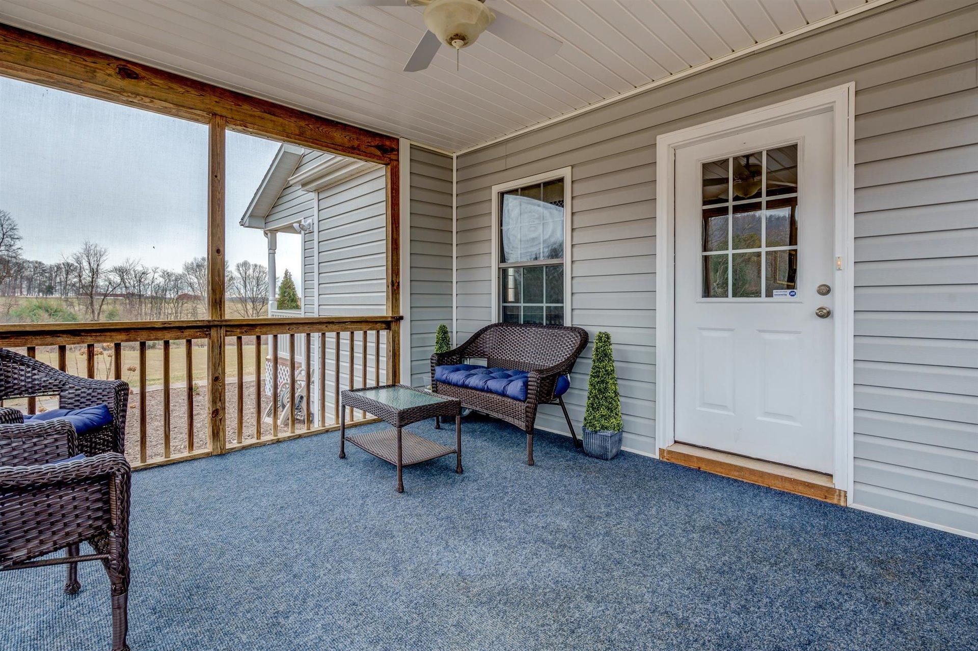 1183 Carroll Road Goodview, VA 24095 - Photo 23 of 61 a view of a porch with furniture and a yard
