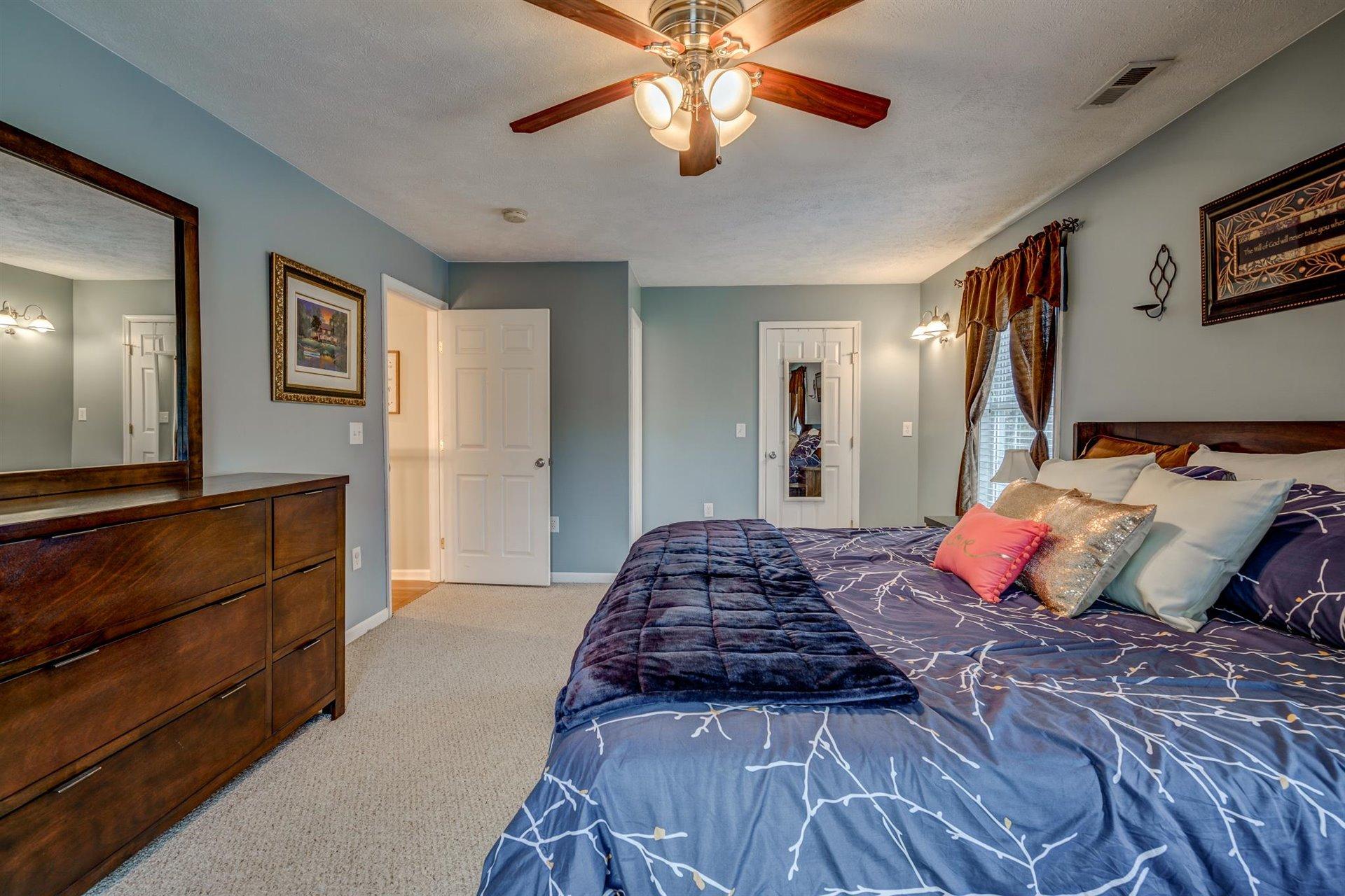 1183 Carroll Road Goodview, VA 24095 - Photo 29 of 61 a bedroom with bed and ceiling fan