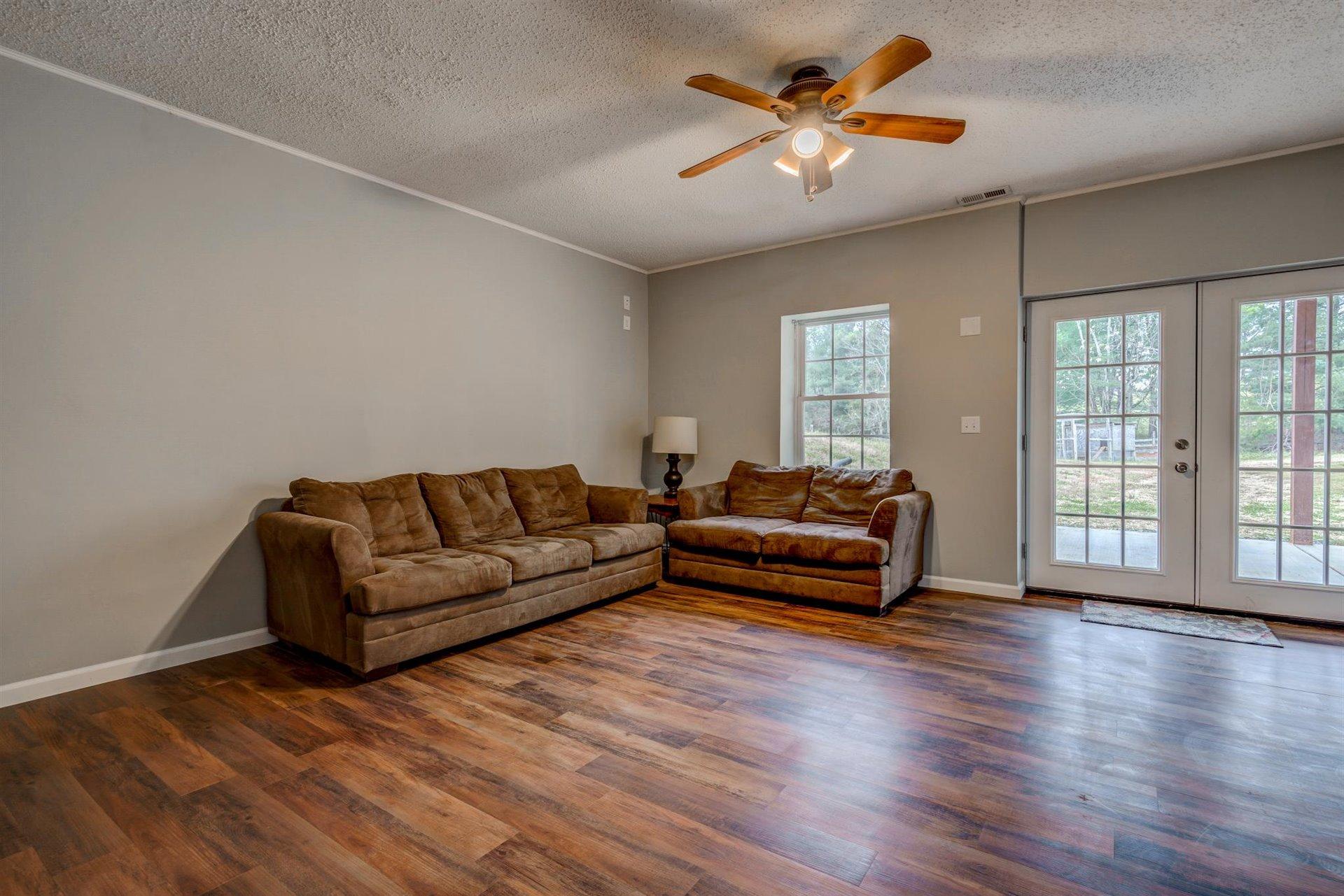 1183 Carroll Road Goodview, VA 24095 - Photo 41 of 61 a living room with furniture and a large window