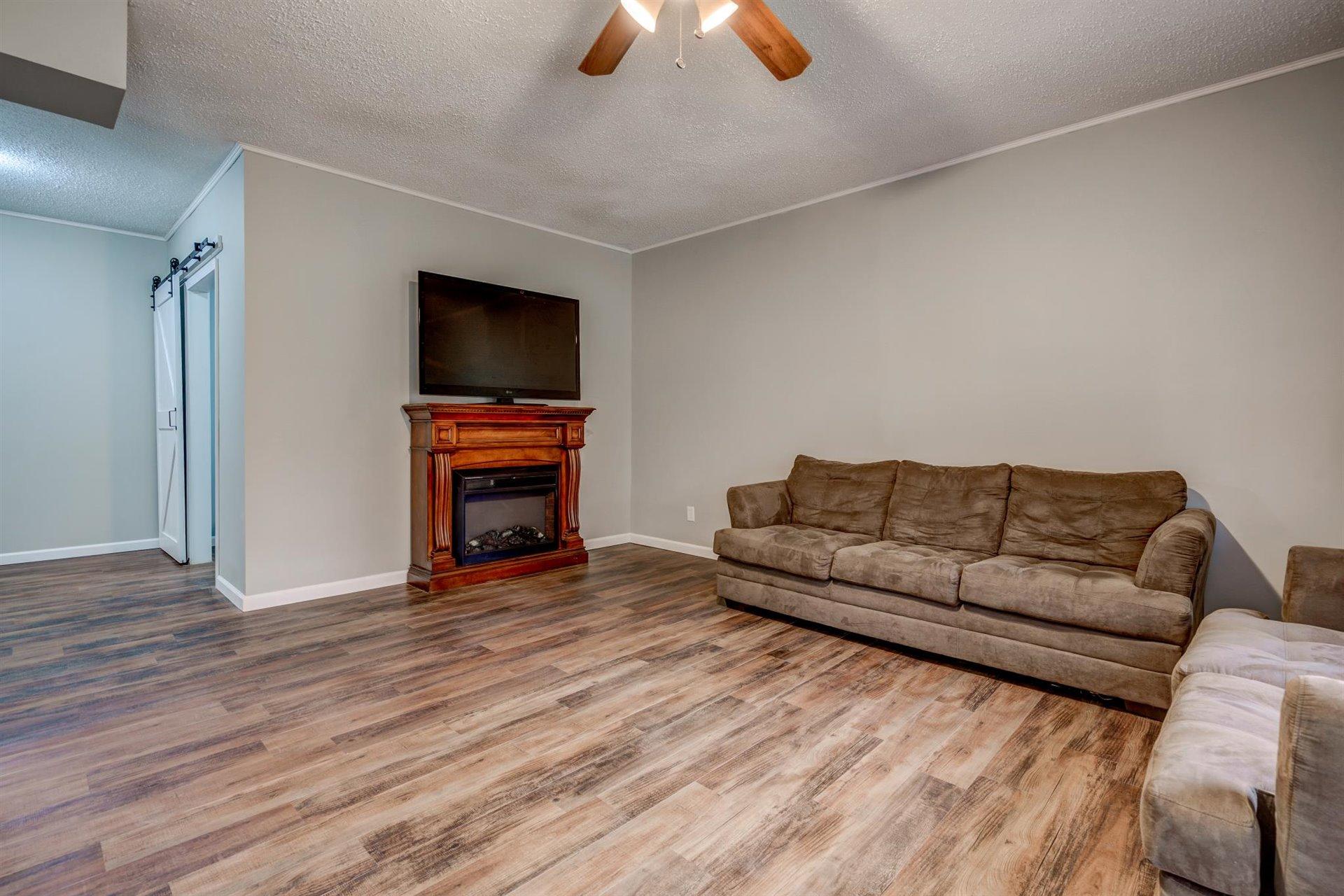 1183 Carroll Road Goodview, VA 24095 - Photo 42 of 61 a living room with furniture and a flat screen tv