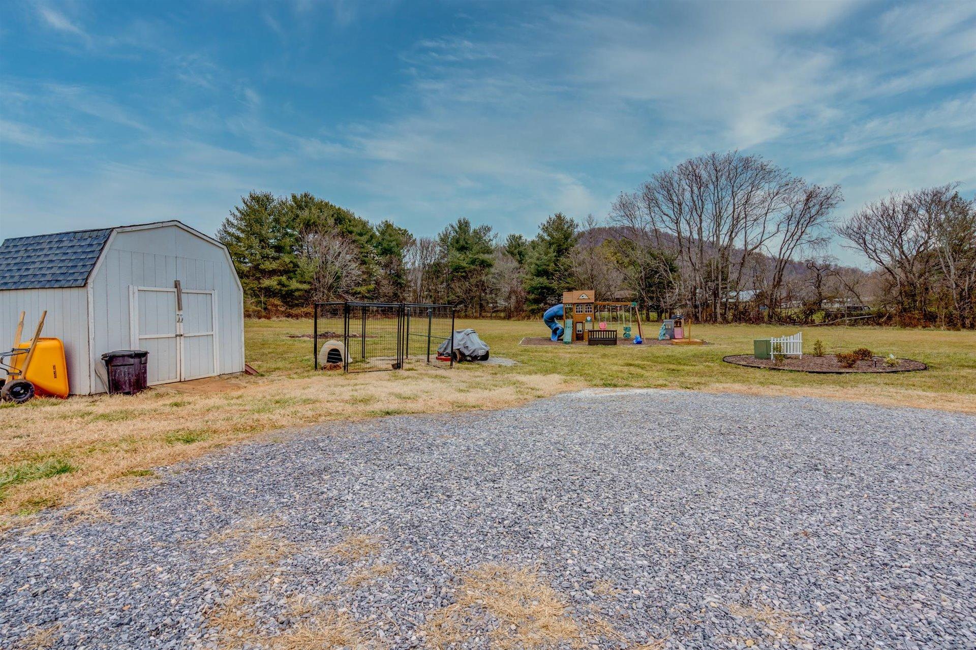 1183 Carroll Road Goodview, VA 24095 - Photo 49 of 61 a view of a house with a yard
