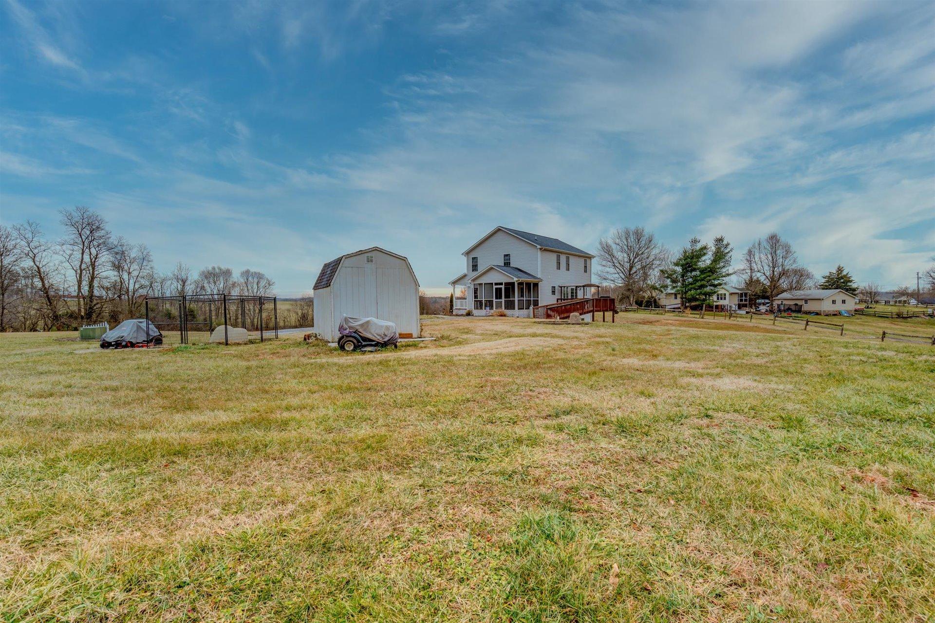 1183 Carroll Road Goodview, VA 24095 - Photo 54 of 61 a view of a houses with a yard